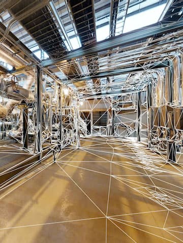 The inside of an empty warehouse with wireframe effects