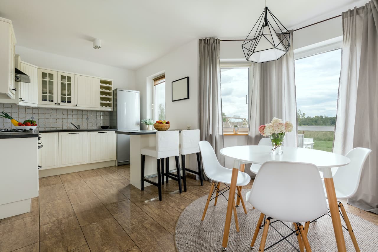 Kitchen and dining room set looking out of a window